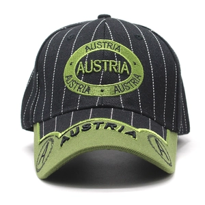 Close-up of black striped baseball cap with green visor and Austria embroidery detail
