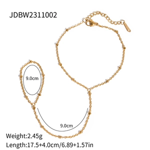 Gold stainless steel slave bracelet with dainty beads and finger ring for women