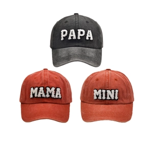 Three washed cotton baseball caps with PAPA, MAMA, and MINI embroidery in dark grey and red