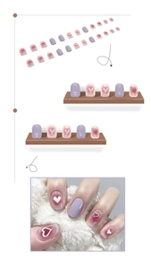 Short lavender press-on nails with 3D heart charms and glossy gradient finish details