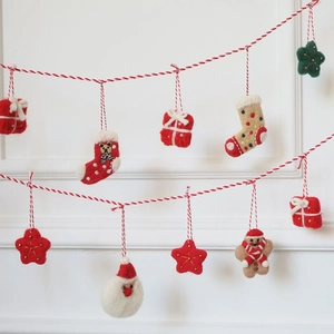 Handmade wool felt Christmas garland with Santa, gingerbread man, and festive stars