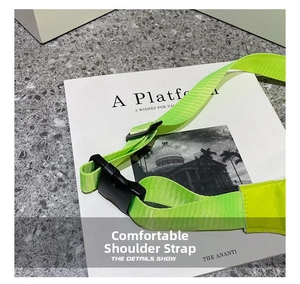 Detail of neon green nylon shoulder strap with adjustable black buckle on chest bag