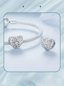 Macro shot of S925 sterling silver hollow leaf heart charm with zircon and S925 hallmark