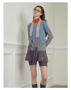 Full-body view of a Y2K striped scarf and colorful faux mink fur neck warmer outfit