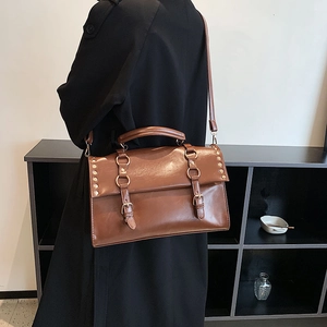 Brown vintage British style satchel with double buckles and adjustable shoulder strap