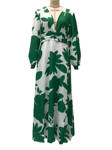 Detailed view of V-neck and lantern sleeves on green floral print maxi dress