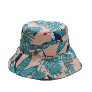 Pink tropical bucket hat with toucan and palm leaf prints for women's outdoor sun protection