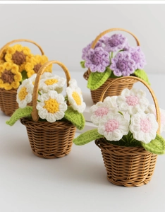 Detail of handcrafted crochet sunflower baskets in assorted colors for home decor