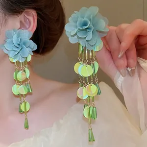 Long floral chiffon tassel earrings with blue fabric flower and iridescent sequins