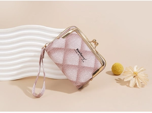 Pink quilted leather mini wallet with gold metal clasp and wristlet strap shown in detail