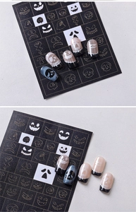 Close-up of Halloween nail stencils featuring ghost and skull airbrush patterns