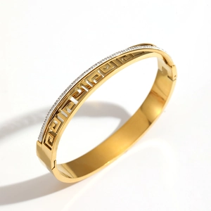 Luxurious gold-plated titanium steel bangle with Greek meander pattern and tiny diamonds
