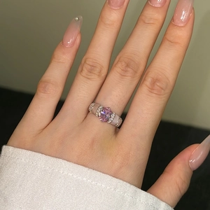 Macro shot of S925 silver ring featuring a pink oval gemstone with crushed ice cut detail