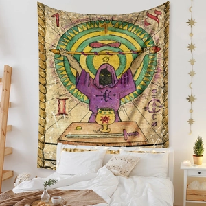 Detail of tarot magician tapestry hung above bed in a cozy bohemian bedroom setup