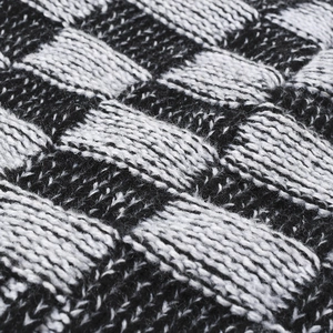 Men's checkered knit beanie with warm fleece lining and black and white pattern