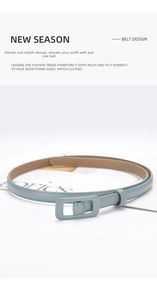 Detail of grey-blue leather belt with matching square buckle and fine edge stitching