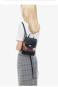 Detailed view of women's mini backpack featuring colorful patchwork and metal buckle