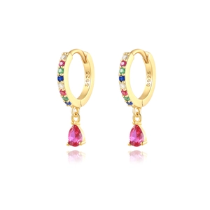 Detail showing S925 hallmark on gold plated hoop earrings with pear cut red crystal