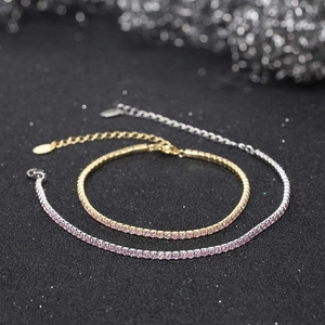 Detail of pink zircon tennis bracelet in gold and silver finish with lobster clasp