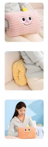Close-up of pink striped plush hand warmer pillow with a cute cartoon smiley face