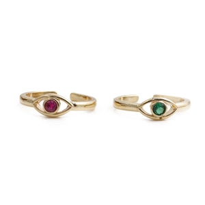 Detail of gold evil eye rings featuring red and green round cut zircon stones