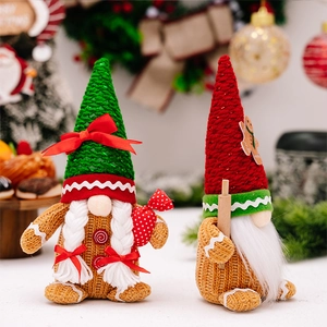 Close-up of Christmas gnomes with gingerbread decorations and knitted holiday details