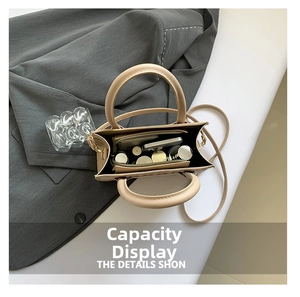Interior view showing spacious capacity of the beige square crossbody bag with compartments