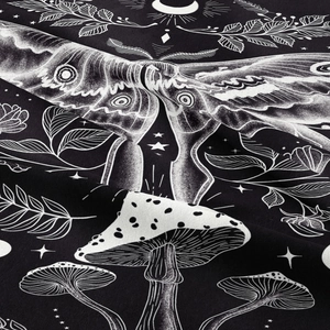 Detailed close-up of moon phase moth tapestry fabric showing moon and mushroom patterns