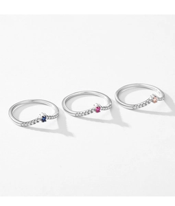 Close-up of three S925 silver rings with blue, red, and clear micro-set zircons