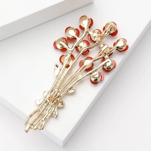 Elegant gold rose brooch with red bead accents for women's fashion outfits