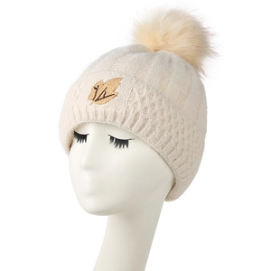 Winter fleece-lined cable knit beanie for women with pompom and maple leaf embroidery