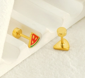 Macro view of gold-plated watermelon stud earrings with secure screw back closure