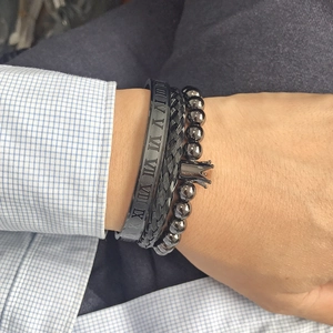 Three-piece set of black stainless steel bracelets with Roman numerals and crown charm