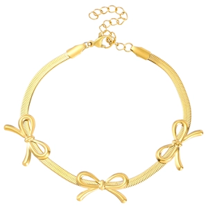 Golden flat woven chain bracelet featuring three dimensional bow elements and lobster clasp