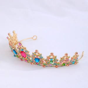 Detail of colorful rhinestones and crystals on a gold bridal crown tiara
