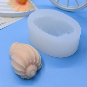 Conch shell silicone mold for DIY baking and handmade candles on blue background