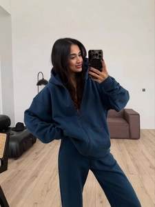 Dark blue hooded tracksuit set featuring zip-up sweatshirt and high waist trousers for women