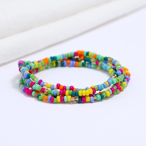 Detailed macro view of multi-layer colorful handmade beads and gold spacers on the waist chain
