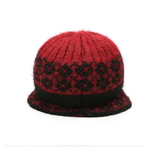 Macro detail of red and black checkered knit hat with soft fuzzy plush texture finish