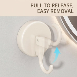 Vacuum suction cup hook in cream white mounted on wall with easy removal mechanism