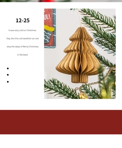 Detail of khaki honeycomb paper Christmas tree ornament hanging on a pine branch