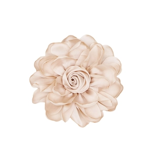 Top view of a handmade champagne satin fabric rose with delicate layered flower petals