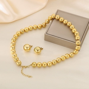 Parure dorée avec collier à billes de 12mm et boucles d'oreilles sur soie beige