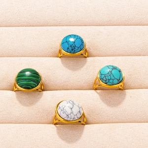 Gold plated stainless steel rings featuring turquoise and malachite round cabochons