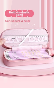 Pink double-layer pencil case detail featuring interior elastic band and stationery set