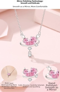 Macro detail of S925 silver heart necklace featuring pink cubic zirconia and mirror polish