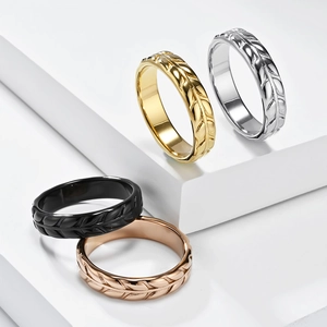 Detailed view of four leaf texture rings in gold, silver, black and rose gold finishes