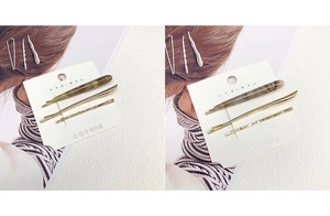 Detailed view of a 3-piece set featuring amber texture and golden alloy hair clips