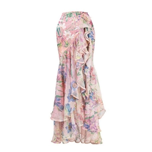 Pink floral maxi skirt with layered ruffles and bohemian mesh panels in a flat lay view