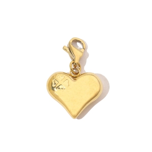 Detail view of a 3D gold heart pendant featuring an embossed clover and lobster clasp